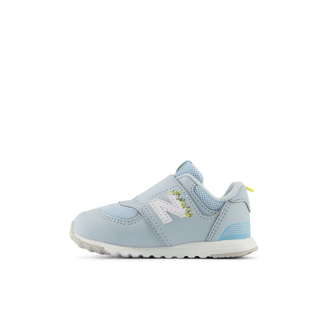 New Balance 574 New-B kids sneaker in bright blue, medial profile.