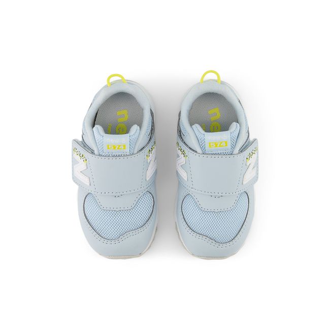 New Balance 574 New-B kids sneaker in bright blue, top-down view.