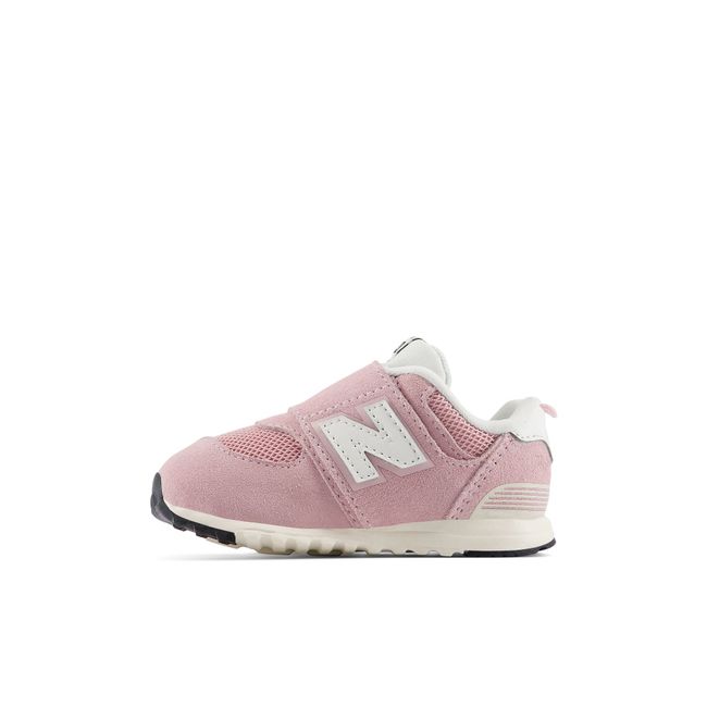 Medial profile of the New Balance baby 574 in soft pink suede and mesh