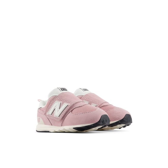 Pair of New Balance baby 574 sneakers in soft pink with white straps