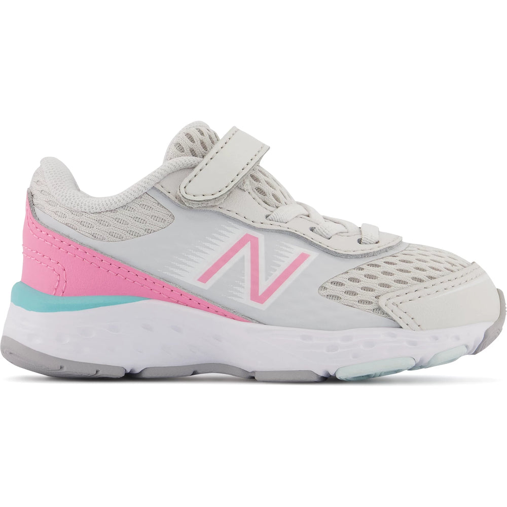 Side of New Balance Kids' 680v6 running shoe in Nimbus Cloud/Bubblegum/Surf