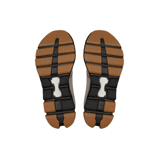 Soles of men&#39;s On Cloud X 4 sneakers with black and copper tread.