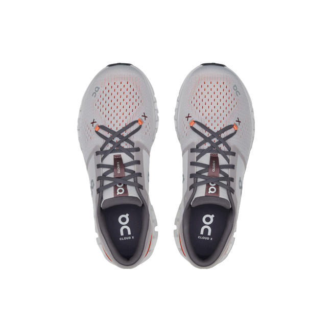 Top-down view of men's On Cloud X 4 sneakers in gray with pops of orange and black.