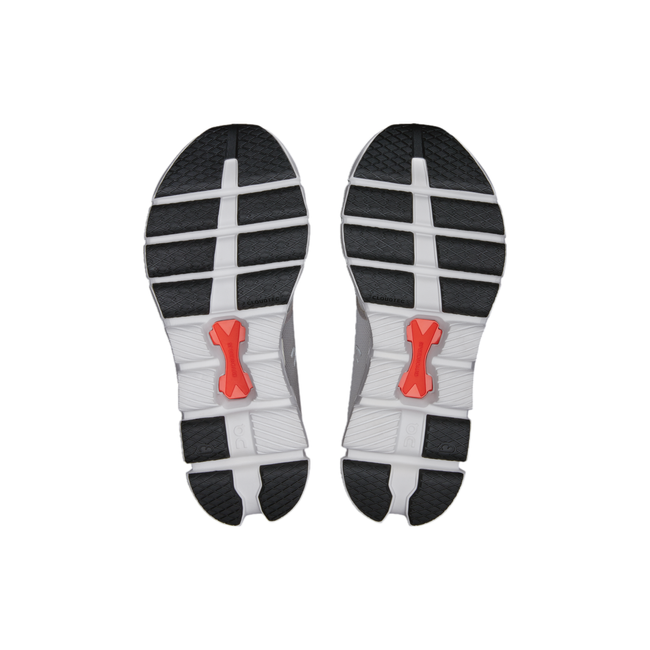 Light gray sole of men's On Cloud X 4 sneakers with black sections of tread and orange Speedboards