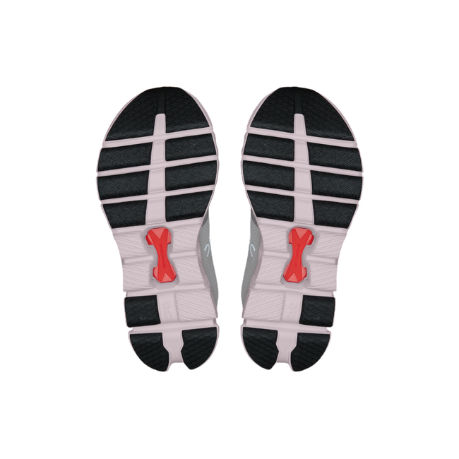 Soles of women's On Cloud X 4 sneakers with a pink sole, black tread, and center orange Speedboard