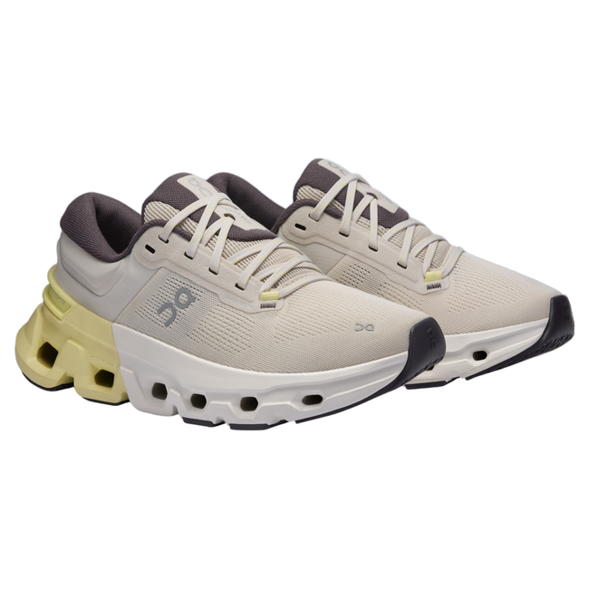 Pair of On Cloud Cloudflyer 5 running shoes in cream with half white, half yellow midsole cushioning