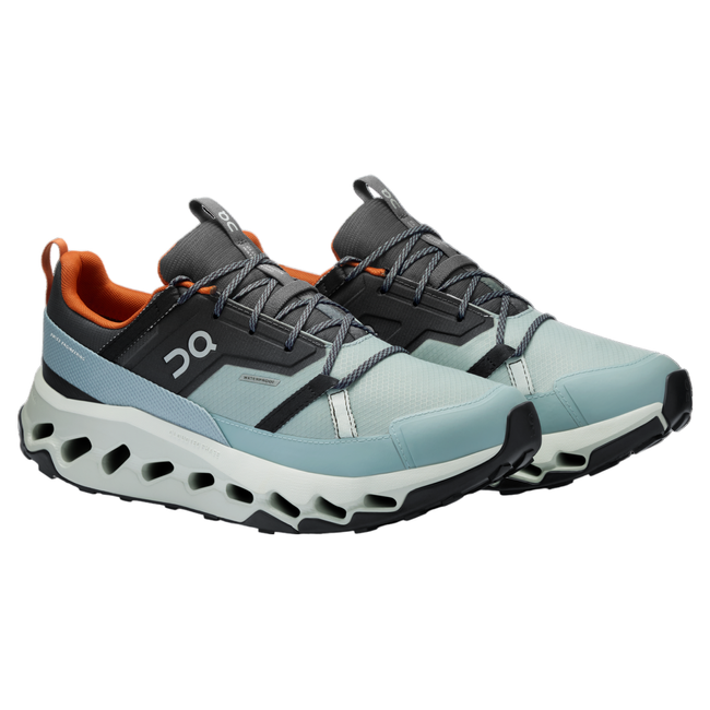 Pair of a blue On Running On Cloud Cloudhorizon Waterproof trail running shoe with orange interior