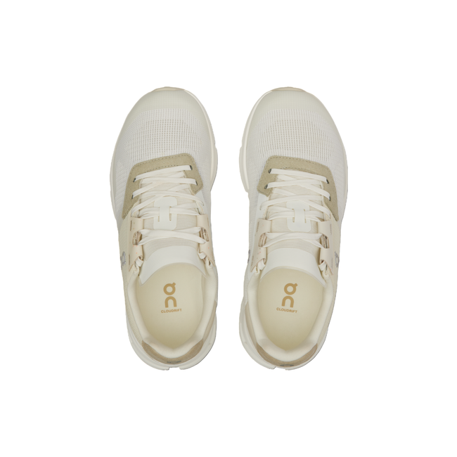 Top-down view of Women's On Cloud Cloudrift Shoes in beige and white