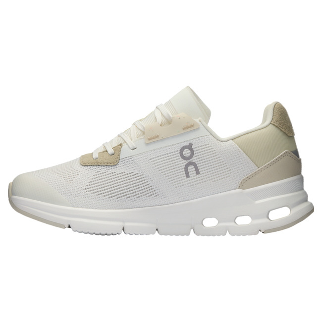 Medial side of Women's On Cloud Cloudrift Shoe in beige and white