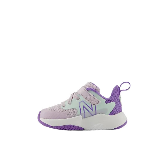 Side profile of New Balance Rave Run V2 toddler shoe in taro purple showing top strap and EVA midsole