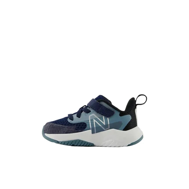 Side profile of New Balance Rave Run V2 infant shoe in navy showing velcro strap and EVA midsole