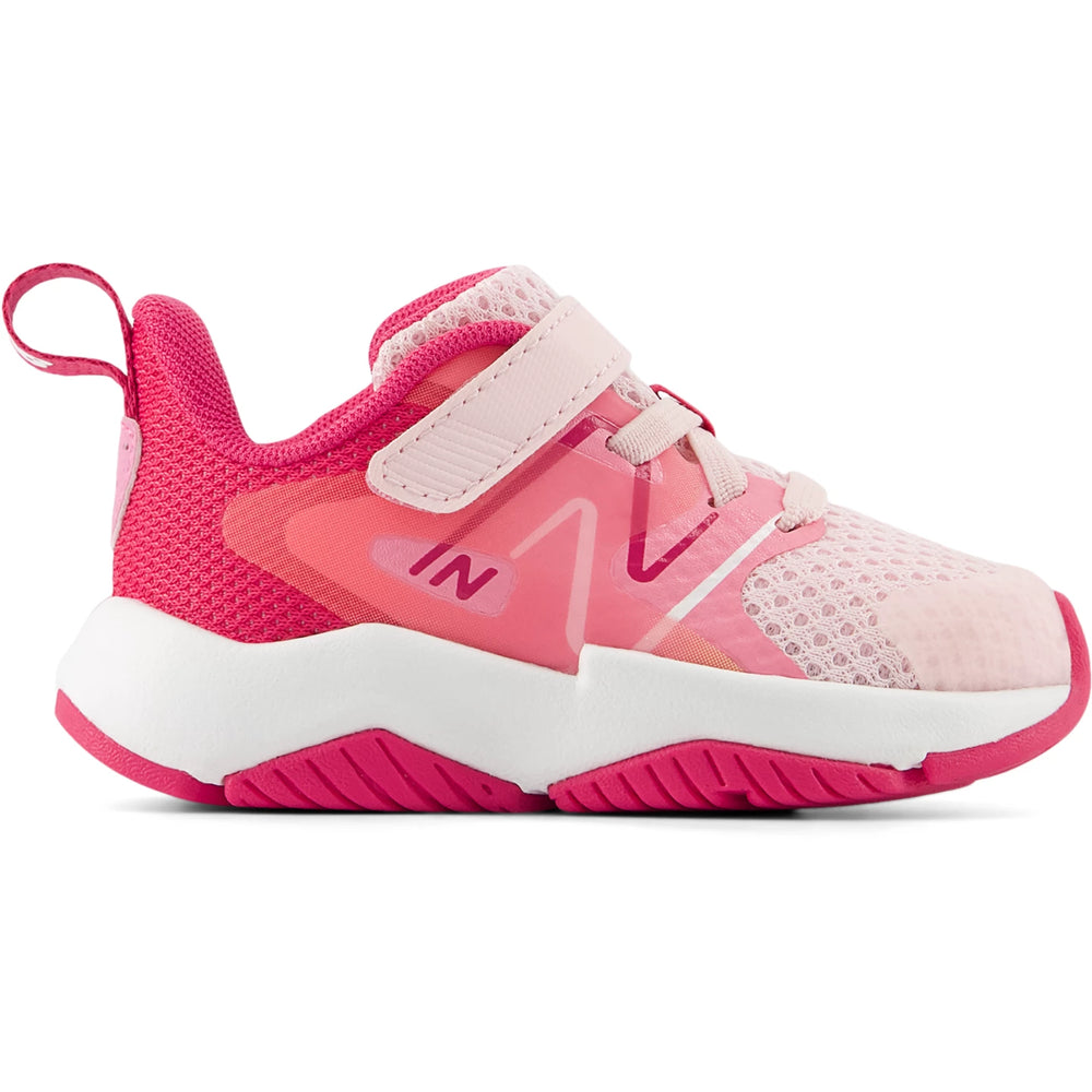 Side of New Balance Kids' Rave Run v2 running shoe in Rose Sugar/Carnival Pink/Signal Pink