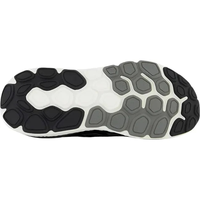 Sole of New Balance Men's 1540 V4 Walking Shoe in black upper with white midsole