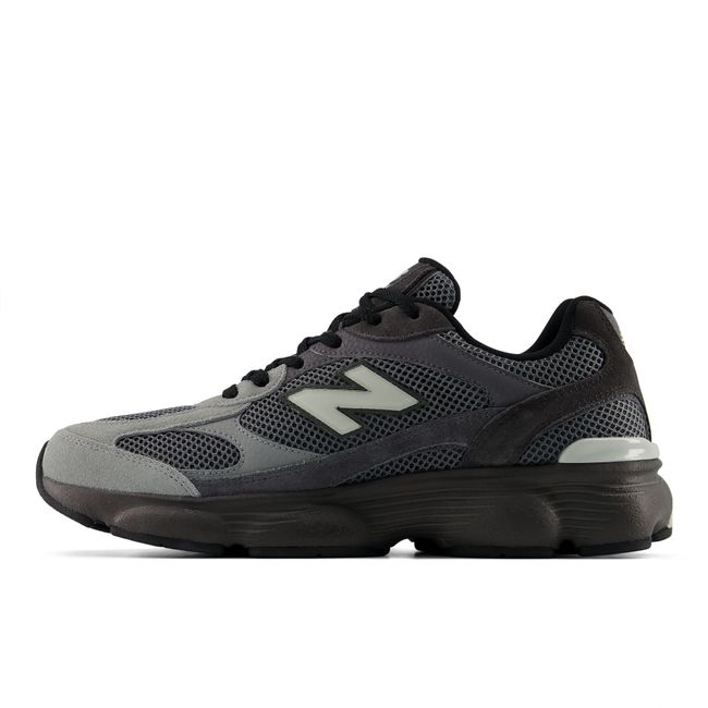 Medial view of New Balance 603 V1 men's sneaker in deep black with dark grey accents