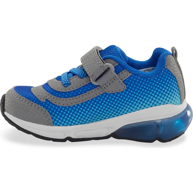 Medial side of Little Kids' Stride Rite Surge Bounce Light Up Sneaker in grey and blue with velcro