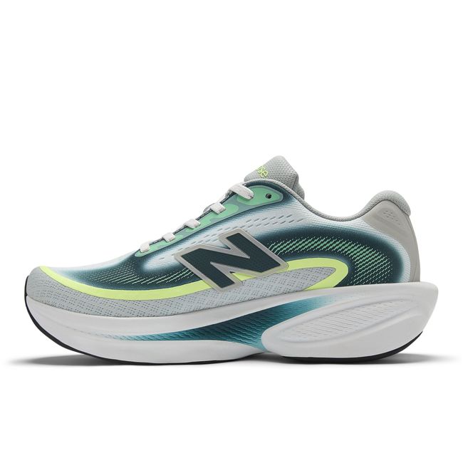 Medial profile of the New Balance Ellipse in grey and teal with a white midsole