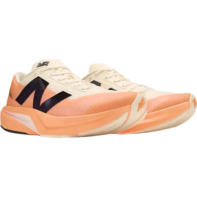 Pair of New Balance Men's FuelCell Rebel V4 Running Shoes in hot mango orange