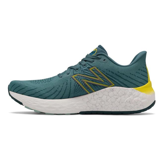 Medial side of New Balance Men's Fresh Foam X Vongo V5 Running Shoe in Deep Sea Sulphur Yellow