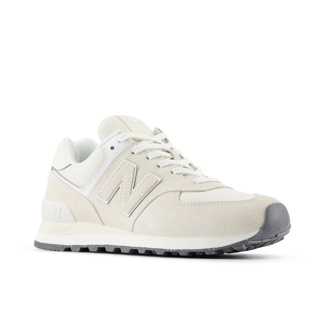 Front angled view of New Balance Women's 574 Lifestyle Shoe in Lenin Sea Salt Beige Suede
