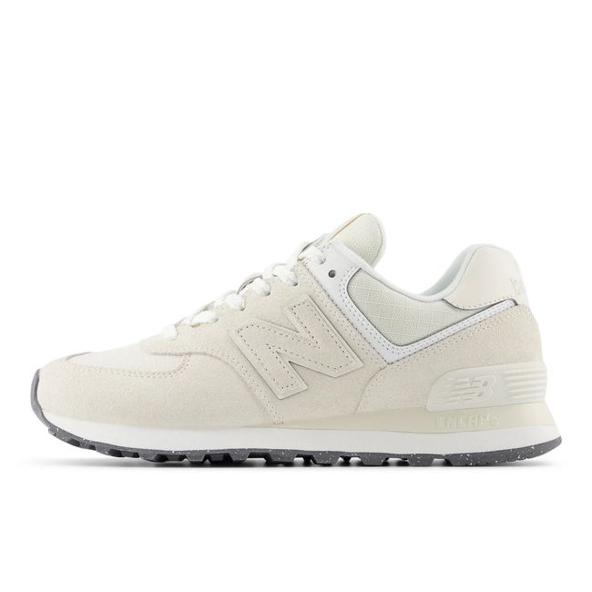 Medial side of New Balance Women's 574 Lifestyle Shoe in Lenin Sea Salt Beige Suede
