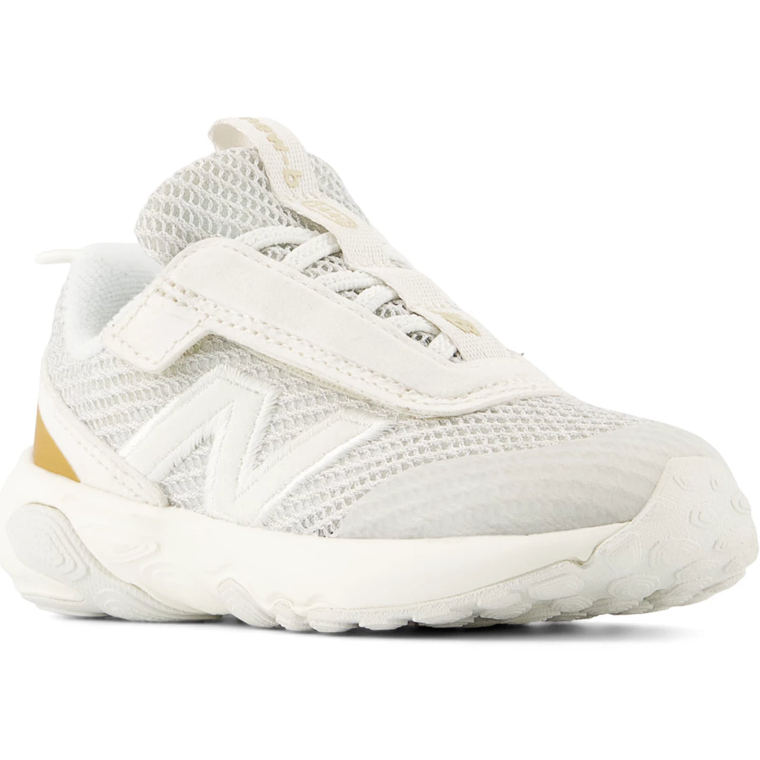 Front angle of New Balance Kids' 1440 running shoe in Sea Salt