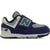 Lateral side of New Balance 574 sneakers in navy with a gray accent and a velcro closure.