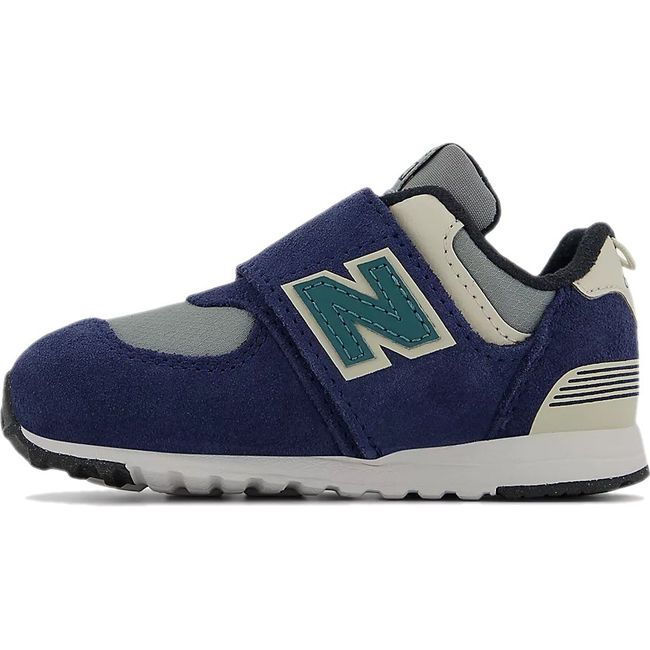 Medial side of New Balance 574 sneakers in navy with a gray accent and a velcro closure.