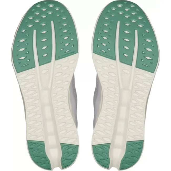 Soles of a white On Running On Cloud Cloudsurfer running shoe with mint green tread sections