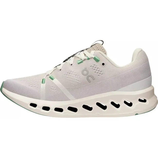 Medial side view of a white On Running On Cloud Cloudsurfer running shoe with mint green details