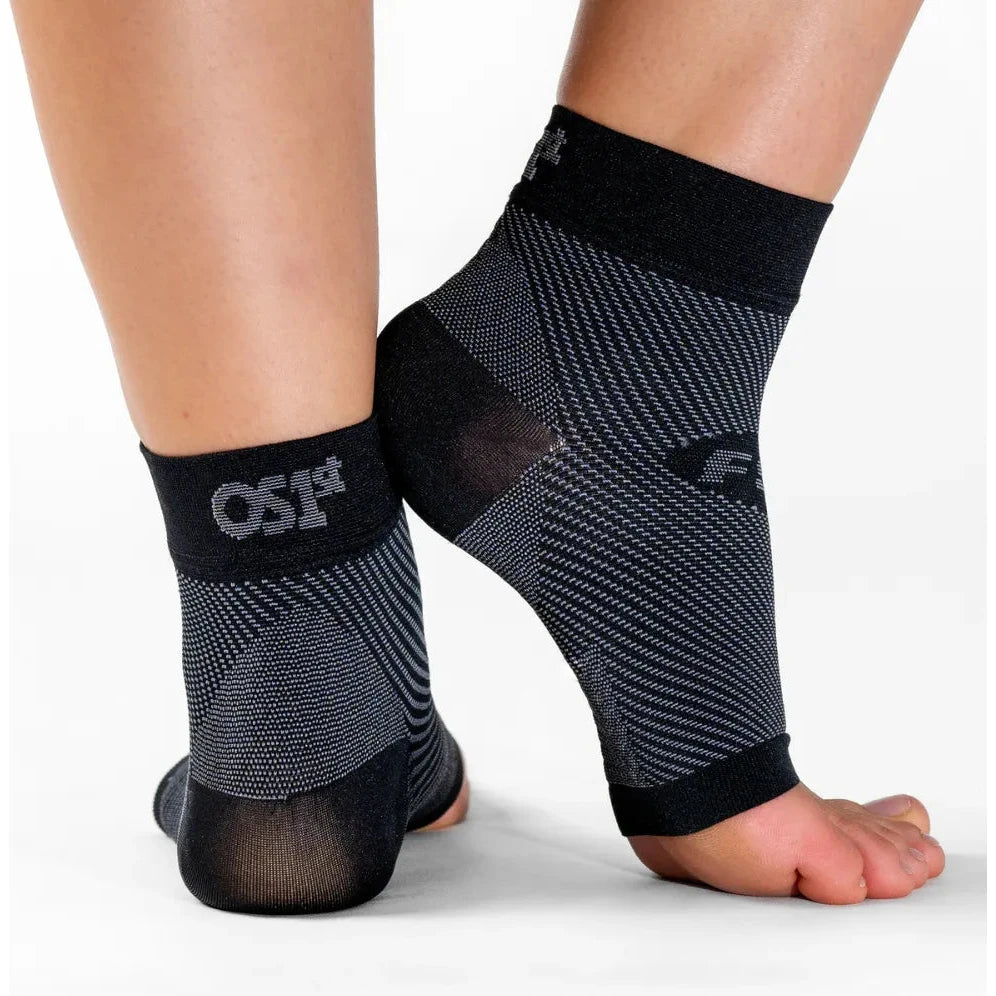 OS1st FS6 Compression Foot Sleeves in Black, shown worn