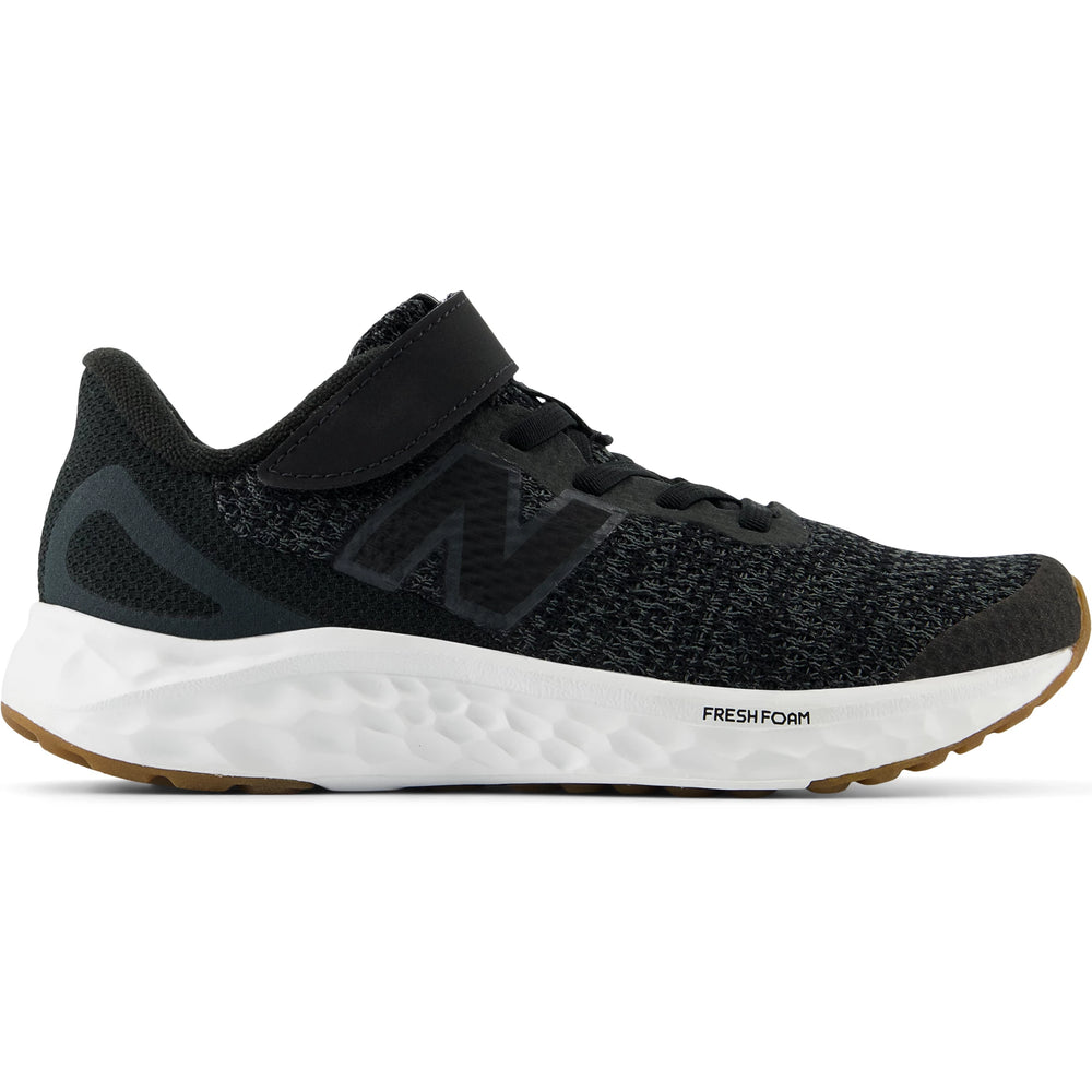 Side of New Balance Kids' Fresh Foam Arishi v4 running shoe in Black/Phantom
