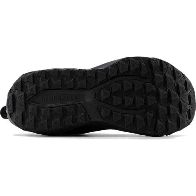Yellow sole of New Balance Little Kids' DynaSoft Nitrel V6 Trail Running Shoe in all black