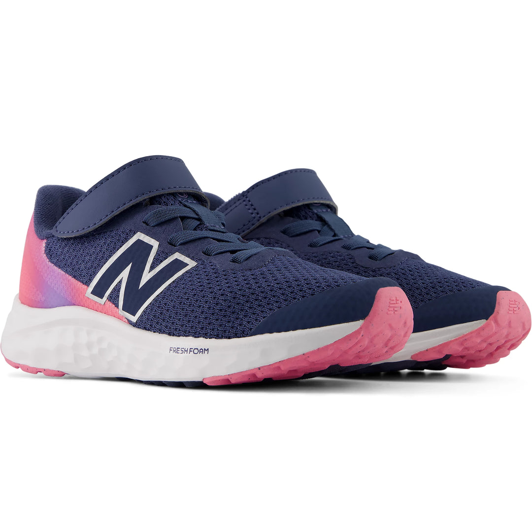 Pair of New Balance Kids' Fresh Foam Arishi v4 running shoes in Vintage Indigo/Signal Pink/Lilac Glo
