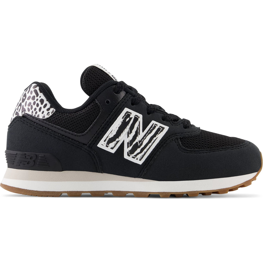 Side of New Balance Kids' 574 sneaker in Black/White