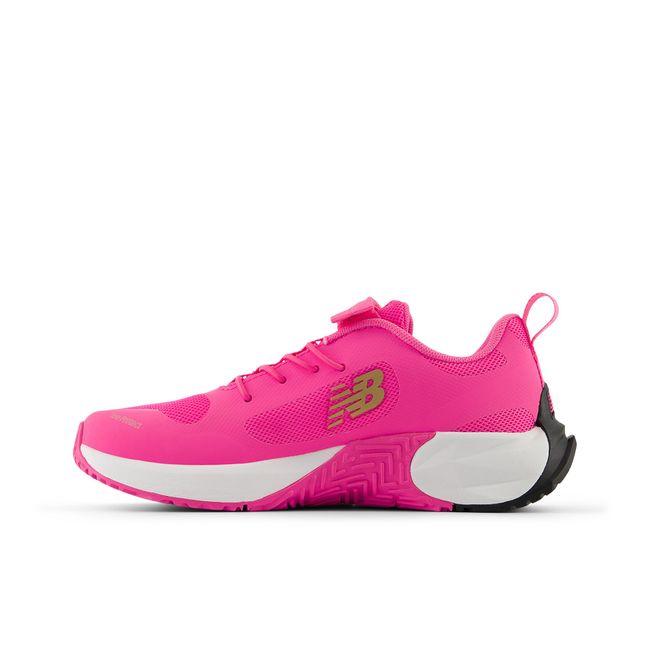 New Balance FuelCell Play kids shoe in pink, medial profile.