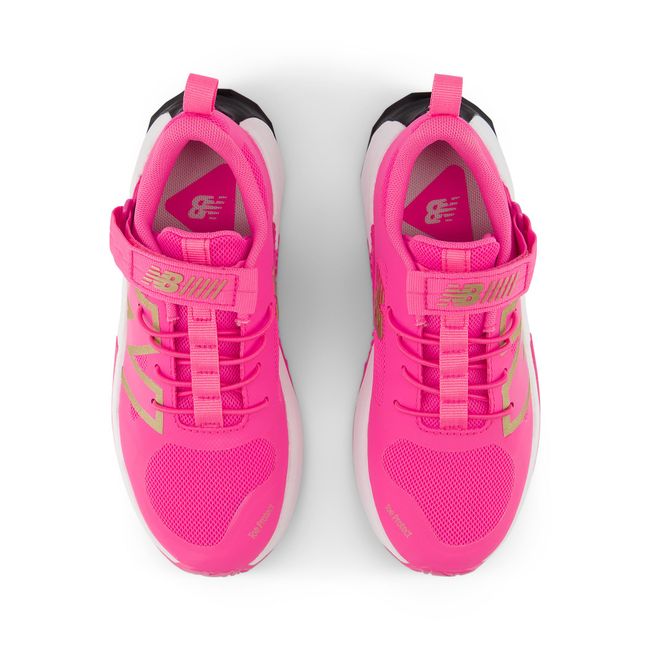 New Balance FuelCell Play kids shoe in pink, top-down view.