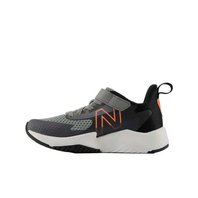 Side profile of New Balance RAV V2 kids' shoe in slate grey showing EVA midsole and hook and loop strap