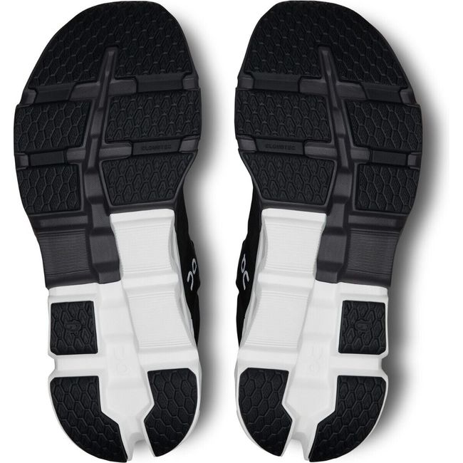 Soles of On Cloud Cloudflyer 5 running shoes in black with a white sole at the heel