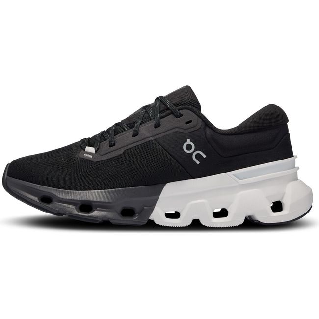 Medial side of On Cloud Cloudflyer 5 running shoe in black with a white sole at the heel