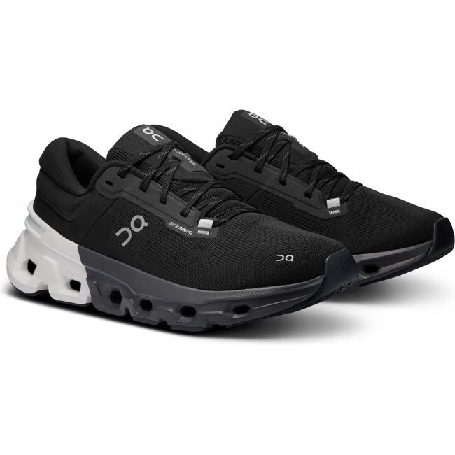 Pair of On Cloud Cloudflyer 5 running shoes in black with a white sole at the heel