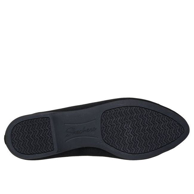 Black outsole of Skechers Cleo women’s flat with textured traction pattern.