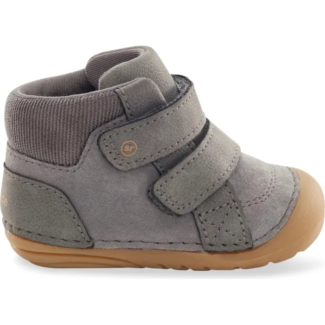 Lateral side of Stride Rite Kids Shoes Martin Boot in grey with two velcro straps and tan sole