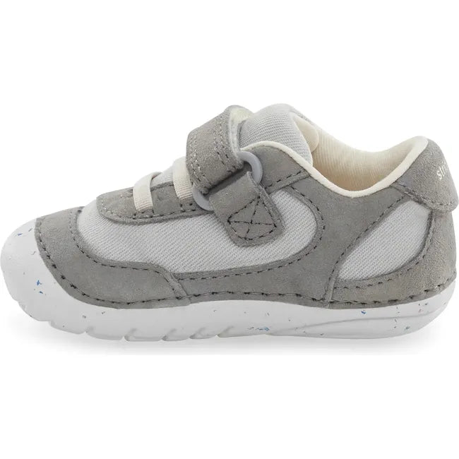 Medial side of Infant Stride Rite Kids' Sprout Sneaker in Light Grey with velcro strap