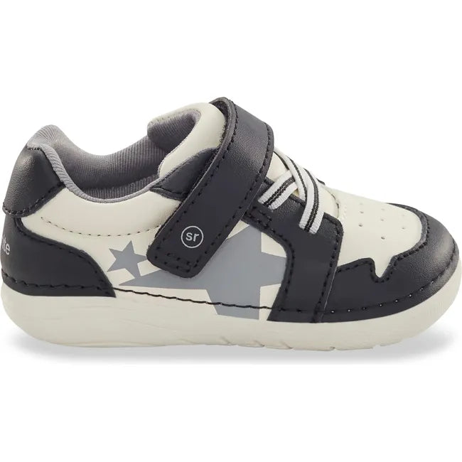 Lateral side of Kids Stride Rite Waverly Sneaker in black and white with velcro strap
