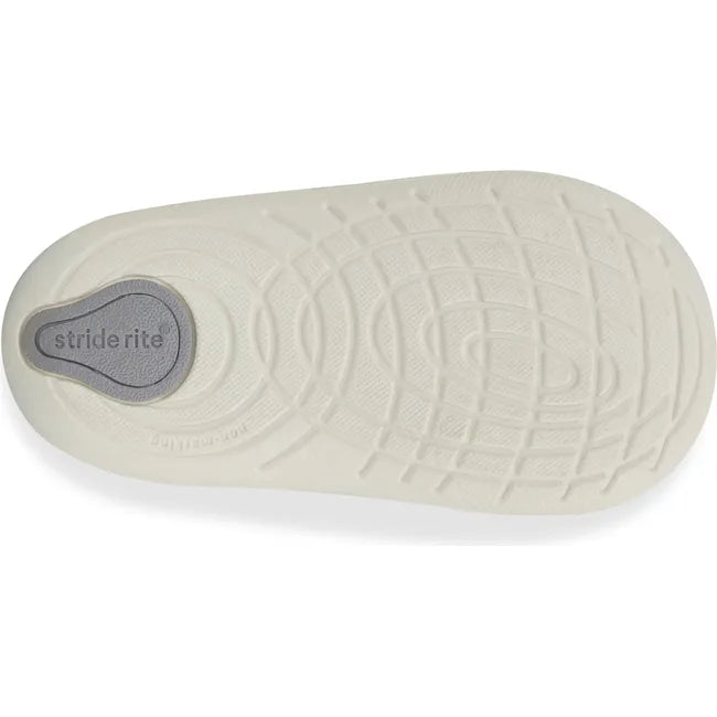 Sole of Kids Stride Rite Waverly Sneaker in black and white upper with white outsole