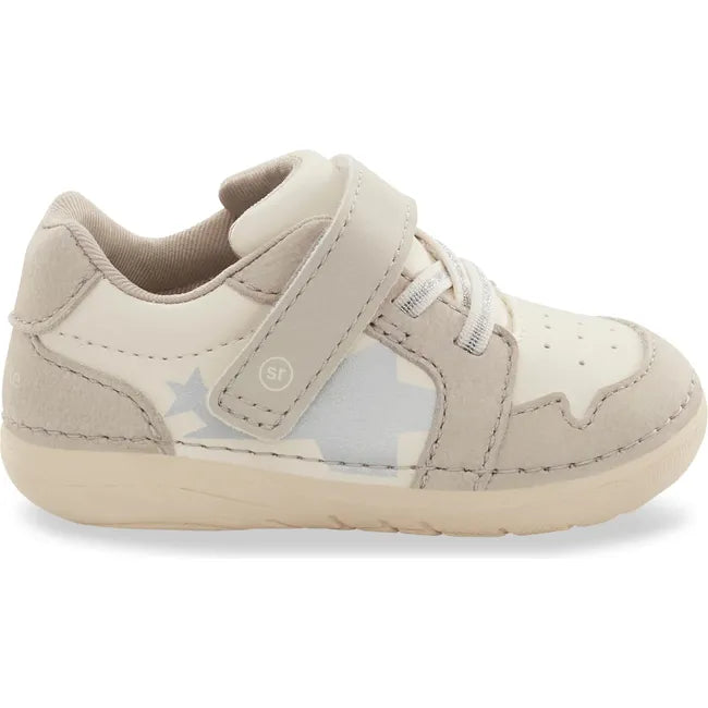 Lateral side of Kids Stride Rite Waverly Sneaker in ecru beige and white with velcro strap