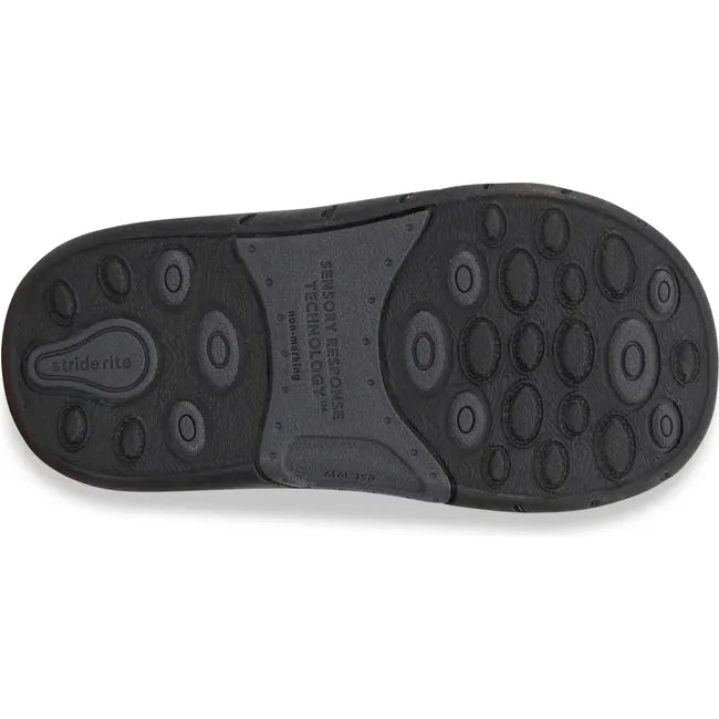 Sole of Kids Stride Rite Lena Boot in black leather upper and black outsole