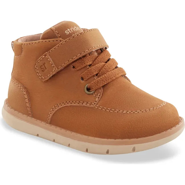 Front angled view of Stride Rite Baby Boot Quinn in hazel tan leather with a velcro strap