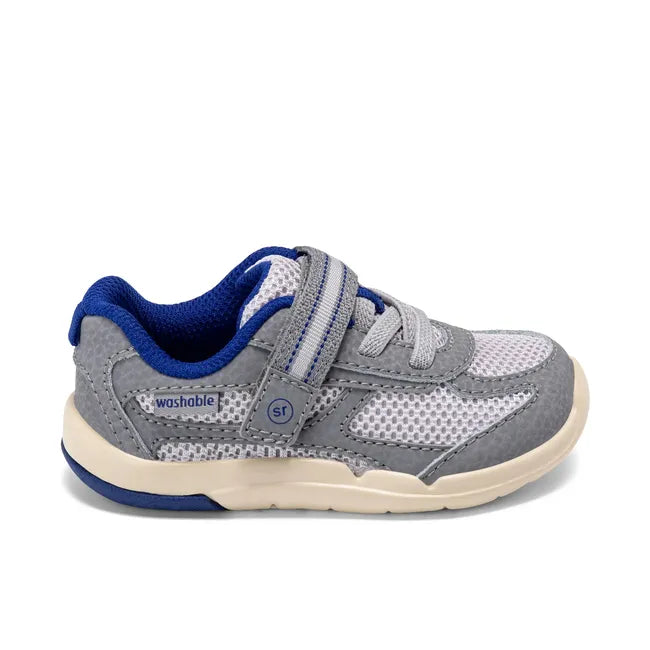 Lateral side of Stride Rite Kids’ Ian 2.0 Sneaker in grey with velcro strap and elastic laces