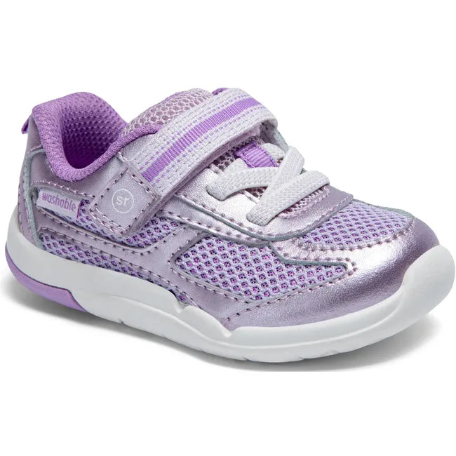 Angled view of Stride Rite Kids’ Ian 2.0 Sneaker in Purple with velcro strap and elastic laces
